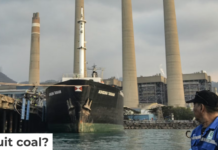 A fisherman looks at the Suralaya coal-fired power plant in Cilegon, Indonesia, in 2023. Ronald Siagian/AFP via Getty Images